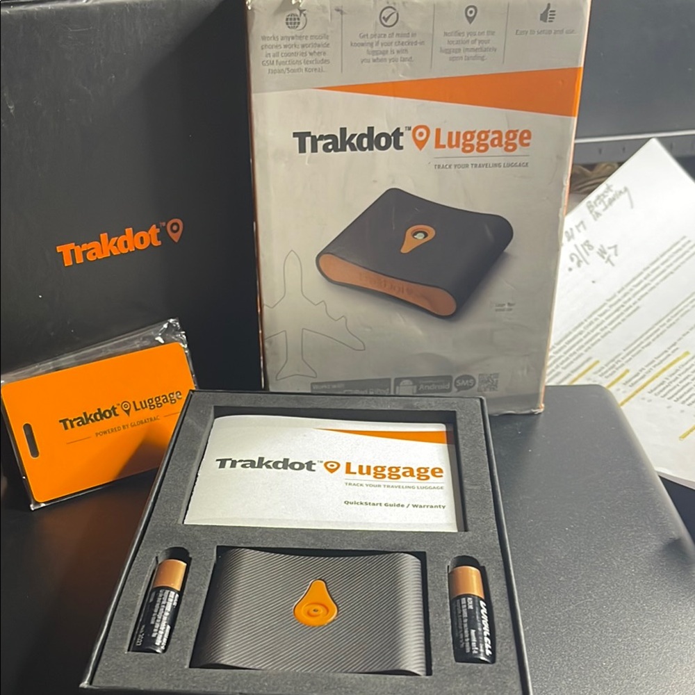New in box- Trakdot Luggage Tracker - Black and Orange